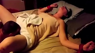 Cuckoliding wife is blindfolded and getting shared around with a friend